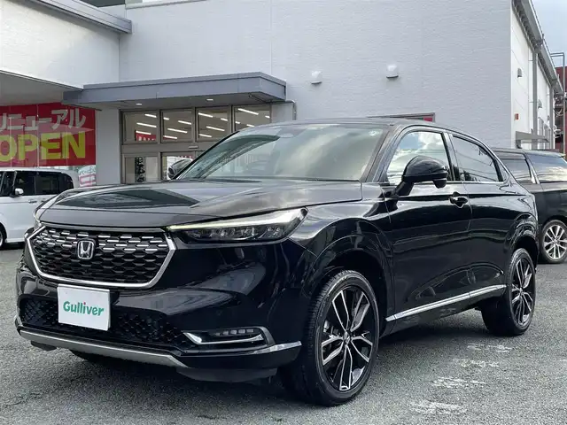 ホンダ ヴェゼル ハイブリッド e:HEV Z 熊本県 2021(令3)年 8.5万km クリスタルブラックパール ワンオーナー/プレミアムオーディオ【10スピーカー】/純正ナビ/【フルセグTV/Bluetooth/USB】/全周囲カメラ/デジタルインナーミラー/レーダークルーズコントロール/ブラインドスポットモニター/シートヒーター/ステアリングヒーター/電子パーキング/オートホールド/オートLEDヘッドライト/純正18インチAW/置くだけ充電/パワーバックドア/ステアリングスイッチ/パドルシフト/前後ドライブレコーダー/ETC2.0/取扱説明書