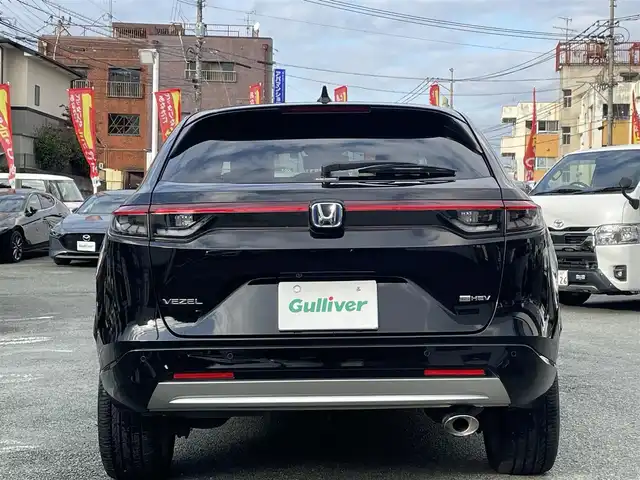 ホンダ ヴェゼル ハイブリッド e:HEV Z 熊本県 2021(令3)年 8.5万km クリスタルブラックパール ワンオーナー/プレミアムオーディオ【10スピーカー】/純正ナビ/【フルセグTV/Bluetooth/USB】/全周囲カメラ/デジタルインナーミラー/レーダークルーズコントロール/ブラインドスポットモニター/シートヒーター/ステアリングヒーター/電子パーキング/オートホールド/オートLEDヘッドライト/純正18インチAW/置くだけ充電/パワーバックドア/ステアリングスイッチ/パドルシフト/前後ドライブレコーダー/ETC2.0/取扱説明書