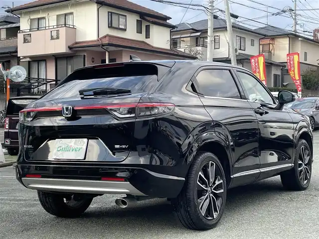 ホンダ ヴェゼル ハイブリッド e:HEV Z 熊本県 2021(令3)年 8.5万km クリスタルブラックパール ワンオーナー/プレミアムオーディオ【10スピーカー】/純正ナビ/【フルセグTV/Bluetooth/USB】/全周囲カメラ/デジタルインナーミラー/レーダークルーズコントロール/ブラインドスポットモニター/シートヒーター/ステアリングヒーター/電子パーキング/オートホールド/オートLEDヘッドライト/純正18インチAW/置くだけ充電/パワーバックドア/ステアリングスイッチ/パドルシフト/前後ドライブレコーダー/ETC2.0/取扱説明書