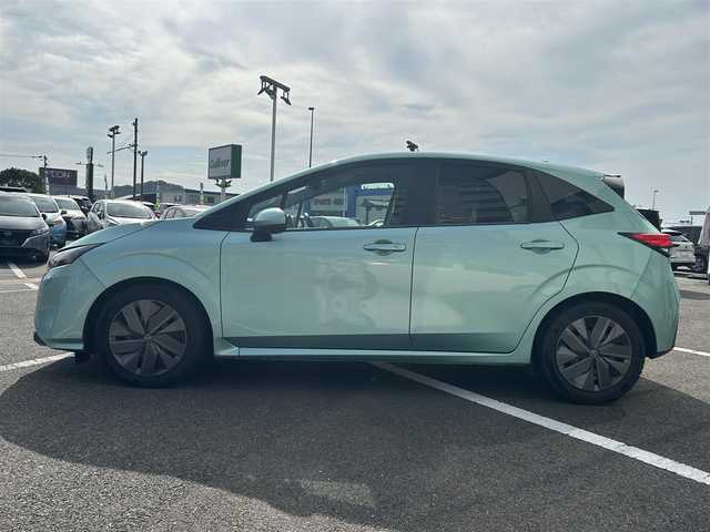 日産 ノート X 長崎県 2023(令5)年 5.5万km 緑／グレー 純正ナビ/Bluetooth接続/全方位カメラ/バックカメラ/プッシュスタート/スマートキー/パワーウィンドウ/パワーステアリング/前後コーナーセンサー/クルーズコントロール/ETC