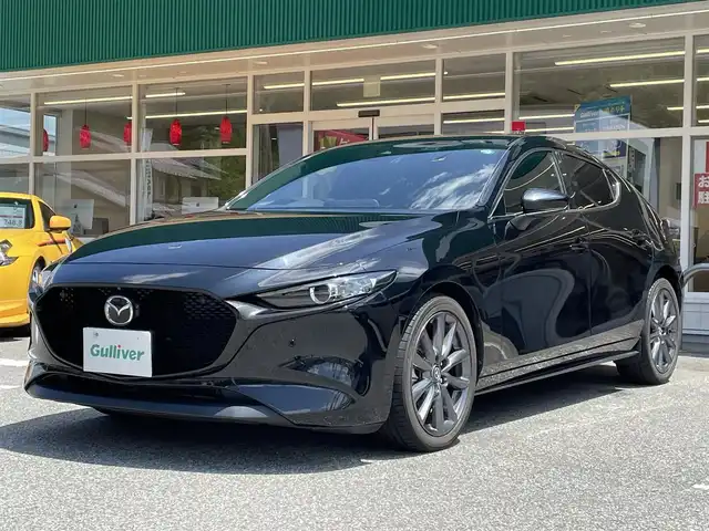 マツダ マツダ３ファストバック 15S ツーリング 岐阜県 2020(令2)年 6.6万km ジェットブラックマイカ ワンオーナー/純正SDナビ/(ワンセグテレビ.AM.FM.Bluetooth)/全方位カメラ/クルーズコントロール/衝突軽減ブレーキ/レーンキープアシスト/コーナーセンサー/純正アルミホイール/ドライブレコーダー/ETC/アイドリングストップ/ウィンカーミラー/プッシュスタート/スマートキー/スペアキー/保証書/取扱説明書