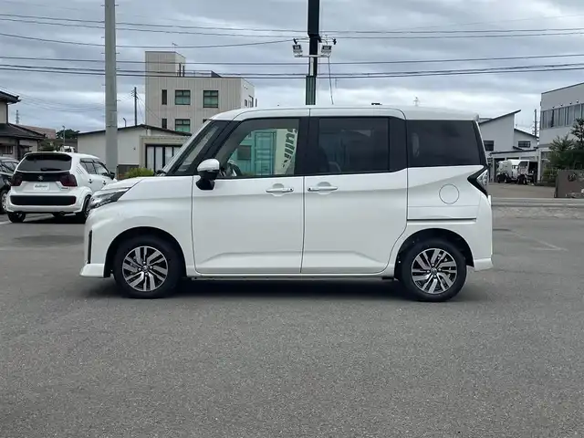 トヨタ ルーミー カスタムG 山形県 2025(令7)年 0.1万km パールホワイトⅢ 衝突被害軽減/純正ディスプレイオーディオ/　　【BT　フルセグ　USB】/全周囲カメラ/両側パワースライドドア/アダプティブクルーズコントロール/LEDオートライト/フォグランプ/シートヒーター/純正14インチアルミホイール/アイドリングストップ/レーンキープアシスト/カーテンエアバック/電動格納ウィンカーミラー/スマートキー