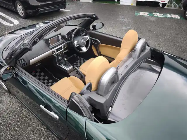 ダイハツ コペン セロ 熊本県 2016(平28)年 9.6万km ブリティッシュグリーンマイカ 純正ナビ（NSCT-W61D）/【ワンセグTV/CD/AM/FM】/バックカメラ/革巻きステアリング/ステアリングスイッチ/シートヒーター/プッシュスタート/スマートキー/純正16インチAW/純正フロアマット/ETC/保証書/取扱説明書