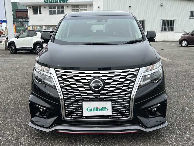 日産 エルグランド 250ハイウェイスターS 富山県 2021(令3)年 1.8万km 黒 スマートキー/ハーフレザーシート/両側パワースライドドア/メーカーオプションメモリーナビ/３列シート/全周囲モニター/BSM/フルセグTV/Bluetooth/ビルトインETC/純正18インチAW/レーダークルーズコントロール/LEDヘッドライト/フォグランプ/純正フロアマット/純正ドアバイザー/横滑り防止装置/電動格納ウィンカーミラー/ドラレコ（前）/オットマン/クリアランスソナー/AFS/ステアリングスイッチ/パワーバックドア/フロントエアロ（NISMO）/USB端子（３個）/保証書・取説・ナビ取説