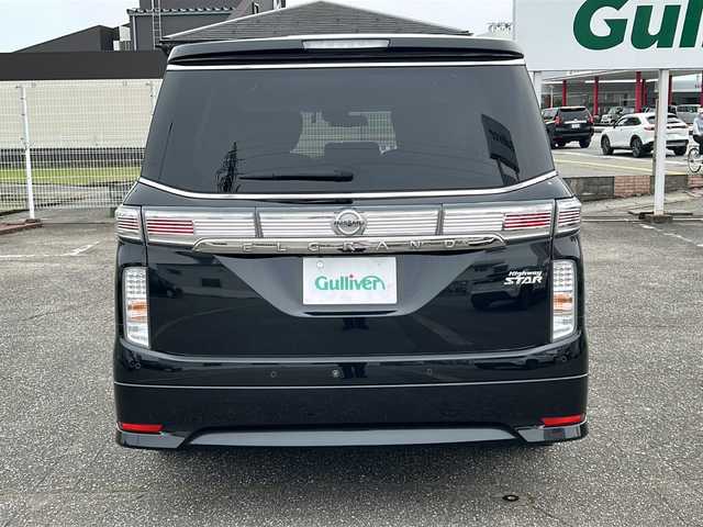 日産 エルグランド 250ハイウェイスターS 富山県 2021(令3)年 1.8万km 黒 スマートキー/ハーフレザーシート/両側パワースライドドア/メーカーオプションメモリーナビ/３列シート/全周囲モニター/BSM/フルセグTV/Bluetooth/ビルトインETC/純正18インチAW/レーダークルーズコントロール/LEDヘッドライト/フォグランプ/純正フロアマット/純正ドアバイザー/横滑り防止装置/電動格納ウィンカーミラー/ドラレコ（前）/オットマン/クリアランスソナー/AFS/ステアリングスイッチ/パワーバックドア/フロントエアロ（NISMO）/USB端子（３個）/保証書・取説・ナビ取説