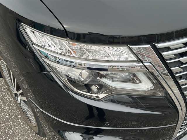 日産 エルグランド 250ハイウェイスターS 富山県 2021(令3)年 1.8万km 黒 スマートキー/ハーフレザーシート/両側パワースライドドア/メーカーオプションメモリーナビ/３列シート/全周囲モニター/BSM/フルセグTV/Bluetooth/ビルトインETC/純正18インチAW/レーダークルーズコントロール/LEDヘッドライト/フォグランプ/純正フロアマット/純正ドアバイザー/横滑り防止装置/電動格納ウィンカーミラー/ドラレコ（前）/オットマン/クリアランスソナー/AFS/ステアリングスイッチ/パワーバックドア/フロントエアロ（NISMO）/USB端子（３個）/保証書・取説・ナビ取説