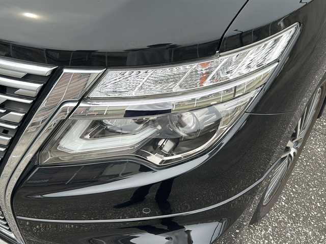 日産 エルグランド 250ハイウェイスターS 富山県 2021(令3)年 1.8万km 黒 スマートキー/ハーフレザーシート/両側パワースライドドア/メーカーオプションメモリーナビ/３列シート/全周囲モニター/BSM/フルセグTV/Bluetooth/ビルトインETC/純正18インチAW/レーダークルーズコントロール/LEDヘッドライト/フォグランプ/純正フロアマット/純正ドアバイザー/横滑り防止装置/電動格納ウィンカーミラー/ドラレコ（前）/オットマン/クリアランスソナー/AFS/ステアリングスイッチ/パワーバックドア/フロントエアロ（NISMO）/USB端子（３個）/保証書・取説・ナビ取説