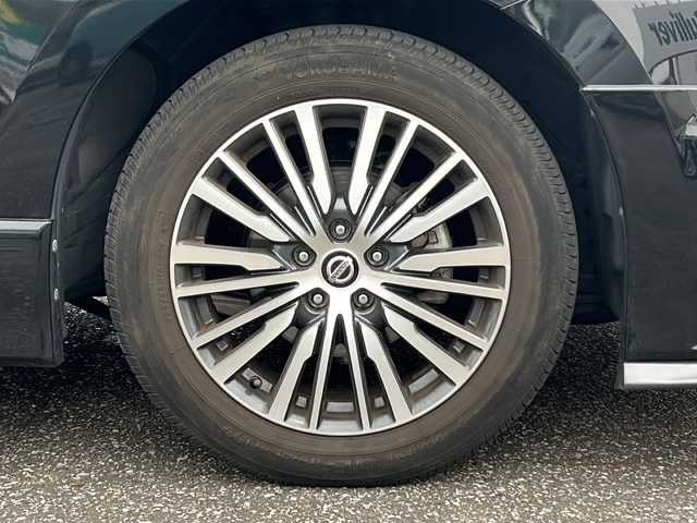 日産 エルグランド 250ハイウェイスターS 富山県 2021(令3)年 1.8万km 黒 スマートキー/ハーフレザーシート/両側パワースライドドア/メーカーオプションメモリーナビ/３列シート/全周囲モニター/BSM/フルセグTV/Bluetooth/ビルトインETC/純正18インチAW/レーダークルーズコントロール/LEDヘッドライト/フォグランプ/純正フロアマット/純正ドアバイザー/横滑り防止装置/電動格納ウィンカーミラー/ドラレコ（前）/オットマン/クリアランスソナー/AFS/ステアリングスイッチ/パワーバックドア/フロントエアロ（NISMO）/USB端子（３個）/保証書・取説・ナビ取説