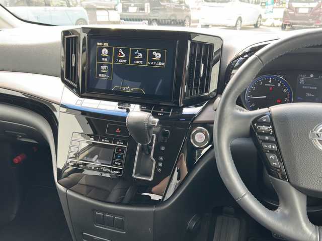 日産 エルグランド 250ハイウェイスターS 富山県 2021(令3)年 1.8万km 黒 スマートキー/ハーフレザーシート/両側パワースライドドア/メーカーオプションメモリーナビ/３列シート/全周囲モニター/BSM/フルセグTV/Bluetooth/ビルトインETC/純正18インチAW/レーダークルーズコントロール/LEDヘッドライト/フォグランプ/純正フロアマット/純正ドアバイザー/横滑り防止装置/電動格納ウィンカーミラー/ドラレコ（前）/オットマン/クリアランスソナー/AFS/ステアリングスイッチ/パワーバックドア/フロントエアロ（NISMO）/USB端子（３個）/保証書・取説・ナビ取説