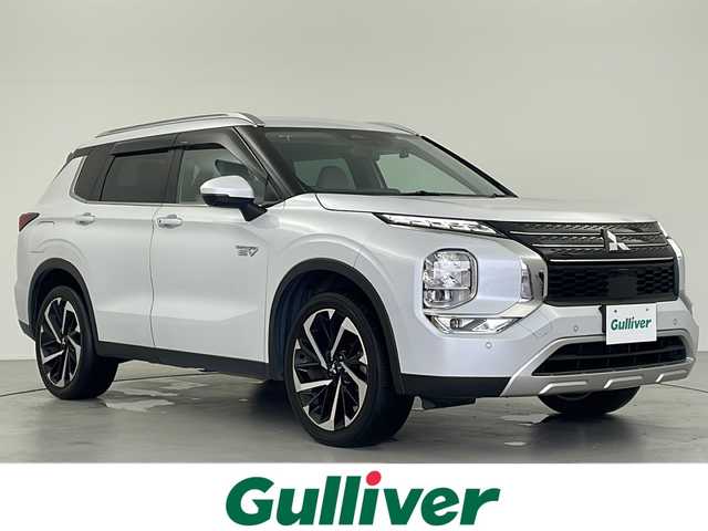 三菱 アウトランダー ＰＨＥＶ G 岐阜県 2022(令4)年 6.5万km ホワイトダイヤモンド 純正９インチナビ　/フルセグＴＶ　/電動テールゲート　/ＭＹパイロット　/革巻きステアリング　/パドルシフト　/ステアリングヒーター/シートヒーター（1列目＋2列目）　/シートメモリー　/パワーシート　/純正ドライブレコーダー　(前後)/置くだけ充電/アラウンドビューモニター/白革シート/ワイパーデアイサー/AC1500W