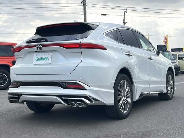 トヨタ ハリアー Z レザーパッケージ 香川県 2023(令5)年 3.1万km 白 T-Connect SDナビ＋JBLプレミアムサウンドシステム（フルセグTV/BT)/アラウンドビューモニター/ヘッドアップディスプレイ/ブラインドスポットモニター/デジタルインナーミラー/ステアリングヒーター/モデリスタ（フロント，サイド，リア）/ガラスルーフ/電動リアゲート/パワーシート/シートヒーター/コーナーセンサー/シートメモリー/ビルトインETC2.0/LEDヘッドライト