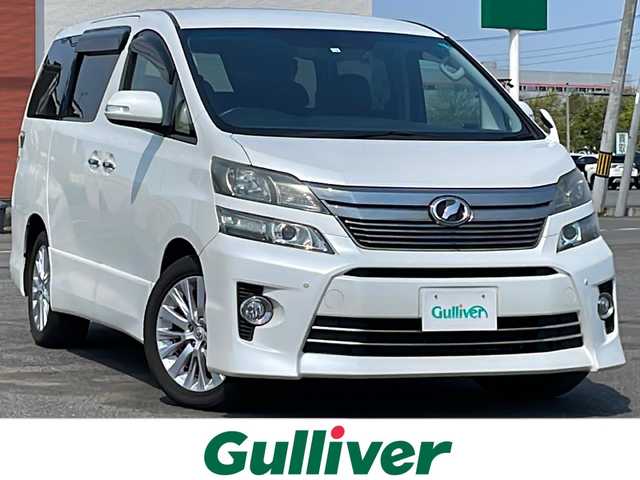 トヨタ ヴェルファイア 2．4Z Gエディション 道央・札幌 2012(平24)年 5.8万km ホワイトパールクリスタルシャイン ４WD/純正ディーラーOPナビ/CD/DVD/BT/フルセグ/横滑り防止装置/クルーズコントロール/クリアランスソナー/バックカメラ/ビルトインETC/ドライブレコーダー/ECOMODE/デフロック/両側パワースライドドア/パワーバックドア/前席/２列目パワーシート/前席シートヒーター/D席メモリーシート/N席/２列目オットマン/レザーシート/革巻きウッドコンビステアリング/ステアリングリモコン/AC100V/自動防眩ミラー/MTモード付AT/nanoe/レーダー探知機/プッシュスタート/スマートキー/HIDヘッドライト/オートライト/フォグランプ/電動格納ミラー/ウィンカーミラー/純正フロアマット/ドアバイザー