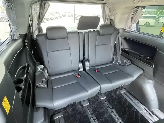 トヨタ ヴェルファイア 2．4Z Gエディション 道央・札幌 2012(平24)年 5.8万km ホワイトパールクリスタルシャイン ４WD/純正ディーラーOPナビ/CD/DVD/BT/フルセグ/横滑り防止装置/クルーズコントロール/クリアランスソナー/バックカメラ/ビルトインETC/ドライブレコーダー/ECOMODE/デフロック/両側パワースライドドア/パワーバックドア/前席/２列目パワーシート/前席シートヒーター/D席メモリーシート/N席/２列目オットマン/レザーシート/革巻きウッドコンビステアリング/ステアリングリモコン/AC100V/自動防眩ミラー/MTモード付AT/nanoe/レーダー探知機/プッシュスタート/スマートキー/HIDヘッドライト/オートライト/フォグランプ/電動格納ミラー/ウィンカーミラー/純正フロアマット/ドアバイザー