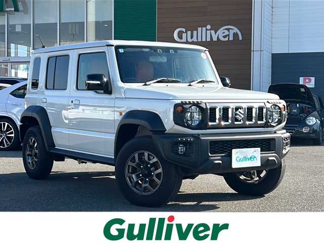 スズキ ジムニー ノマド FC 佐賀県 2025(令7)年 0.4万km アークティックホワイトパール エンジンスタートボタン/アイドリングストップ/スマートキー/クルーズコントロール/Bluetooth接続/CD再生/ETC/バックカメラ/AUX/前席シートヒーター/社外フロアマット/純正アルミホイール/ABS/横滑り防止装置/後ろコーナーセンサー/レーンキープアシスト/盗難防止装置/オートライト/ダウンヒルアシストコントロール/衝突被害軽減システム/ステアリングスイッチ/電格ミラー/クリアランスソナー