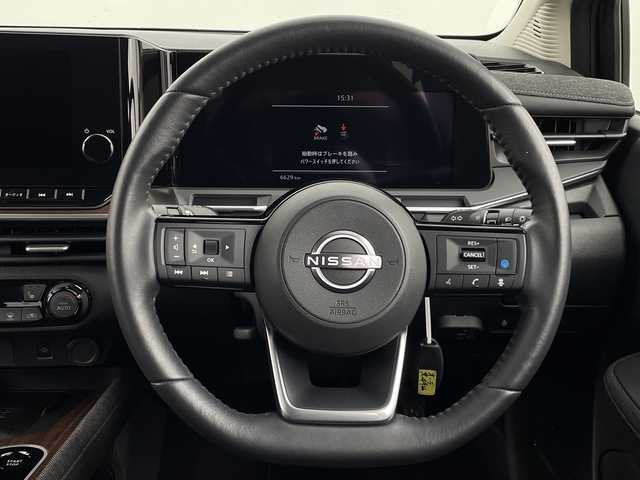 日産 オーラ G レザーエディション 新潟県 2024(令6)年 0.7万km ミッドナイトブラック/サンライズカッパー エマージェンシーブレーキ/スマートルームミラー/ワイヤレス充電/純正ナビ/フルセグTV/Bluetooth/アラウンドビューモニター/プロパイロット/LEDオートライト/オートハイビーム/シートヒーター/ステアリングヒーター/純正17インチアルミホイール/ステアリングリモコン/電格ミラー/ウィンカーミラー/スマートキー/ビルトインETC2.0