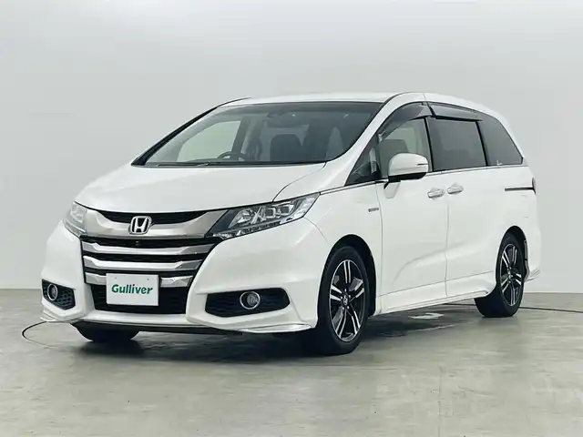 ホンダ オデッセイ ハイブリッド 福島県 2017(平29)年 7.4万km ホワイトオーキッドパール ホンダセンシング　/・車線逸脱警報/・CMBS/・BSM/・レーダークルーズコントロール/・レーンアシスト/・車線逸脱警報/全方位カメラ　/純正ナビゲーション　/ＥＴＣ　/両側パワースライドドア　/ハーフレザーシート　/・パワーシート　/ドライブレコーダー　/プッシュスタート　/・スマートキー　/・スペアキー　/オートライト　/・LＥＤライト/オットマン/革巻きステアリング/・ステアリングスイッチ/・チルトステアリング/保証書/・取扱説明書/