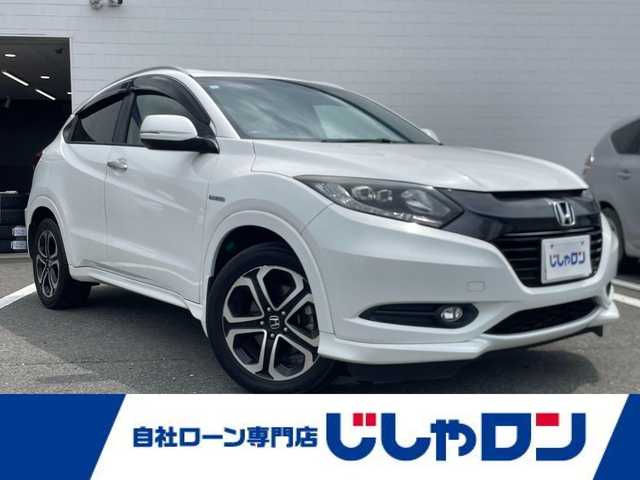 ホンダ ヴェゼル ハイブリッド Z 熊本県 2015(平27)年 11.1万km ホワイトオーキッドパール (株)IDOMが運営する【じしゃロン熊本店】の自社ローン専用車両になります/こちらは現金またはオートローンご利用時の価格です。自社ローンご希望の方は別途その旨お申付け下さい./社外ナビ/バックカメラ/ステアリングスイッチ/クルーズコントロール/シートヒーター/パドルシフト/電動パーキング/LEDヘットライト