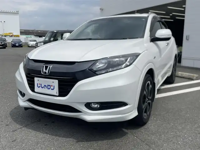 ホンダ ヴェゼル ハイブリッド Z 熊本県 2015(平27)年 11.1万km ホワイトオーキッドパール (株)IDOMが運営する【じしゃロン熊本店】の自社ローン専用車両になります/こちらは現金またはオートローンご利用時の価格です。自社ローンご希望の方は別途その旨お申付け下さい./社外ナビ/バックカメラ/ステアリングスイッチ/クルーズコントロール/シートヒーター/パドルシフト/電動パーキング/LEDヘットライト