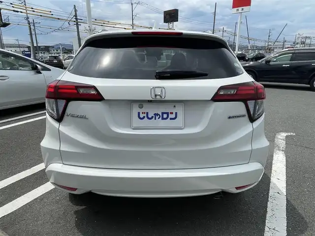 ホンダ ヴェゼル ハイブリッド Z 熊本県 2015(平27)年 11.1万km ホワイトオーキッドパール (株)IDOMが運営する【じしゃロン熊本店】の自社ローン専用車両になります/こちらは現金またはオートローンご利用時の価格です。自社ローンご希望の方は別途その旨お申付け下さい./社外ナビ/バックカメラ/ステアリングスイッチ/クルーズコントロール/シートヒーター/パドルシフト/電動パーキング/LEDヘットライト