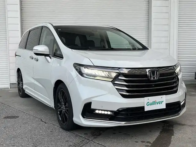 ホンダ オデッセイ ハイブリッド 高知県 2021(令3)年 8.4万km プラチナホワイトパール 10インチギャザズナビ/Bluetooth接続/ETC/ドライブレコーダー/全方位カメラ/WAC/純正フロアマット/純正18インチアルミホイール/電動リアゲート/運転席、助手席パワーシート/シートヒーター/両側パワースライドドア/ハンズフリースライドドア/横滑り防止装置/衝突被害軽減システム/盗難防止装置/レーンキープアシスト/コーナーセンサー/運転席＋助手席＋サイドエアバッグ/カーテンエアバッグ