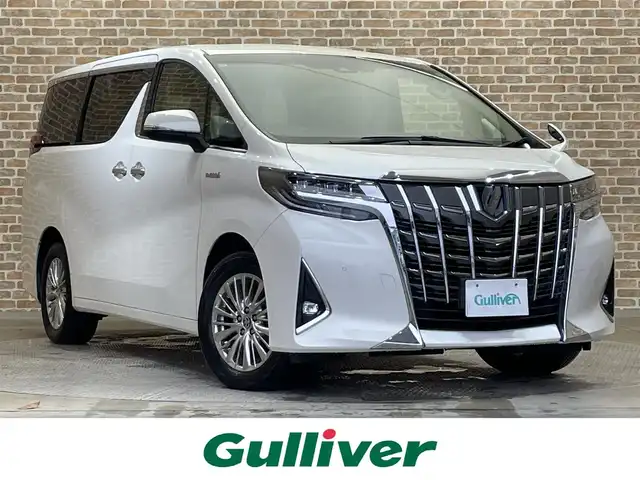 トヨタ アルファードハイブリット G 岩手県 2019(令1)年 4.6万km ラグジュアリーホワイトパールクリスタルシャインガラスフレーク ワンオーナー/４WD/12.1型後席ディスプレイ/両側パワースライドドア/パワーバックドア/トヨタセーフティセンス/プリクラッシュセーフティ/レーダークルーズコントロール/レーントレーシングアシスト/ロードサインアシスト/オートマチックハイビーム/先行車発進告知/クリアランスソナー/オートブレーキホールド/MTモード付AT/合成皮革シート/パワーシート/シートヒーター・シートベンチレーション/リヤサンシェード/純正ナビ/フルセグTV/ドライブレコーダー/ETC2.0/バックカメラ/LEDヘッドランプ/LEDフォグランプ/純正１７インチアルミホイール