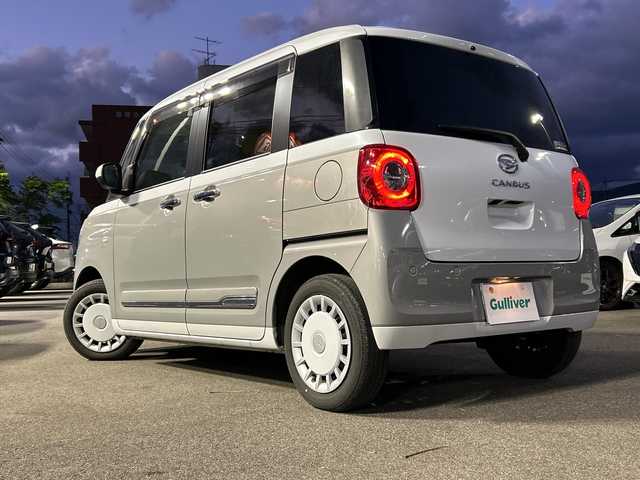 ダイハツ ムーヴ キャンバス ストライプス G 山口県 2023(令5)年 2.3万km シャイニングホワイトパール/スムーズグレーマイカメタリック 純正ディスプレイオーディオ/（USB/HDMI/Bluetooth/AppleCarPlay/androidauto）/全方位カメラ/電動パーキング/シートヒーター（D/N）/両側パワースライドドア/オートライト/オートライトハイビーム/オートブレーキホールド/ワイヤレス充電/温ドリンクホルダー/レザーシートカバー/ドライブレコーダー/ETC/アイドリングストップ