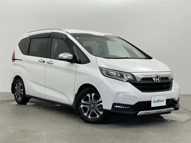 ホンダ フリード クロスター ホンダセンシング 富山県 2020(令2)年 3.9万km プラチナホワイトパール 社外ナビ(AM/FM/BT/CD/DVD)/フルセグTV/バックカメラ/エンジンスターター/レーダークルーズコントロール/衝突軽減装置/レーンキープアシスト/両側パワースライドドア/ウインドシールドデアイサー/アイドリングストップ/横滑り防止装置/ETC/後方コーナーセンサー/前席シートヒーター/LEDヘッドライト/オートライト/純正AW/社外フロアマット/フォグランプ/スマートキー/スペアキー1本/プッシュスタート/取扱説明書/保証書