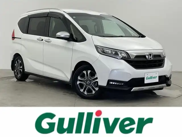 ホンダ フリード クロスター ホンダセンシング 富山県 2020(令2)年 3.9万km プラチナホワイトパール 社外ナビ(AM/FM/BT/CD/DVD)/フルセグTV/バックカメラ/エンジンスターター/レーダークルーズコントロール/衝突軽減装置/レーンキープアシスト/両側パワースライドドア/ウインドシールドデアイサー/アイドリングストップ/横滑り防止装置/ETC/後方コーナーセンサー/前席シートヒーター/LEDヘッドライト/オートライト/純正AW/社外フロアマット/フォグランプ/スマートキー/スペアキー1本/プッシュスタート/取扱説明書/保証書