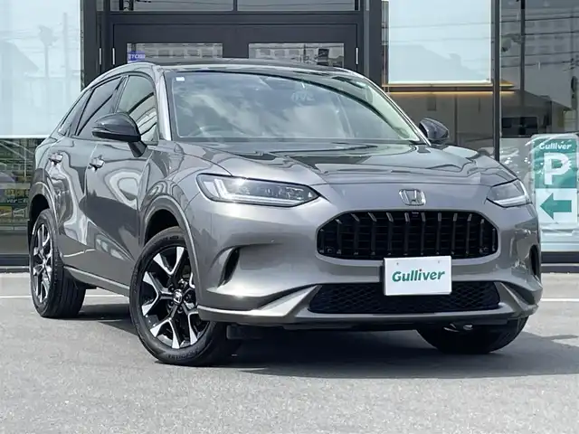 ホンダ ＺＲ－Ｖ ハイブリッド e:HEV Z 茨城県 2023(令5)年 1.4万km スーパープラチナグレーメタリック 純正ナビ/【AM・FM・USB・BT・TV】/パワーシート/シートメモリ/シートヒーター/電動リアゲート/ワイヤレス充電/ダウンヒルアシストコントロール/ブレーキホールド/レーダークルコン/ETC2.0/全方位カメラ/前後ドラレコ/前後コーナーセンサー/パドルシフト/純正フロアマット/純正アルミホイール/横滑り防止装置/レーンキープアシスト/衝突被害軽減システム