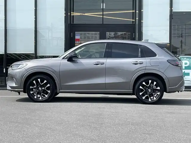 ホンダ ＺＲ－Ｖ ハイブリッド e:HEV Z 茨城県 2023(令5)年 1.4万km スーパープラチナグレーメタリック 純正ナビ/【AM・FM・USB・BT・TV】/パワーシート/シートメモリ/シートヒーター/電動リアゲート/ワイヤレス充電/ダウンヒルアシストコントロール/ブレーキホールド/レーダークルコン/ETC2.0/全方位カメラ/前後ドラレコ/前後コーナーセンサー/パドルシフト/純正フロアマット/純正アルミホイール/横滑り防止装置/レーンキープアシスト/衝突被害軽減システム