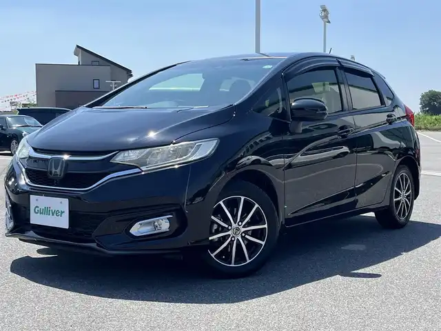 ホンダ フィット 13G FパックコンフォートED 奈良県 2018(平30)年 7万km クリスタルブラックパール 純正ナビ　/フルセグＴＶ/BT/CD/DVD/SD/USB/AUX/iPod/バックカメラ　/追従型クルーズコントロール　/ビルトインＥＴＣ　/ＡＡＣ　/シートヒーター　/ＬＥＤヘッドライト　/オートライト　/衝突被害軽減システム　/レーンキープアシスト　/スマートキー/盗難防止装置/社外15インチアルミホイール/純正フロアマット