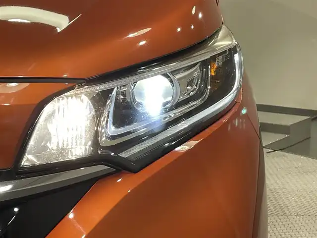 ホンダ フリード ハイブリット G ホンダセンシング 愛知県 2020(令2)年 4.7万km プレミアムクリスタルオレンジM KENWOOD7インチナビ/（Bluetooth/AM/FM/フルセグTV）/衝突軽減ブレーキ/両側電動スライドドア/レーダークルーズコントロール/シートヒーター/LEDヘッドライト/ETC/バックカメラ/コーナーセンサー/レーンキープアシスト/プッシュスタートボタン/スマートキー/純正15インチAW/社外ホイール付きスタッドレス