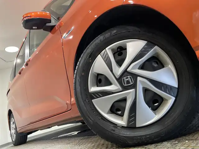 ホンダ フリード ハイブリット G ホンダセンシング 愛知県 2020(令2)年 4.7万km プレミアムクリスタルオレンジM KENWOOD7インチナビ/（Bluetooth/AM/FM/フルセグTV）/衝突軽減ブレーキ/両側電動スライドドア/レーダークルーズコントロール/シートヒーター/LEDヘッドライト/ETC/バックカメラ/コーナーセンサー/レーンキープアシスト/プッシュスタートボタン/スマートキー/純正15インチAW/社外ホイール付きスタッドレス