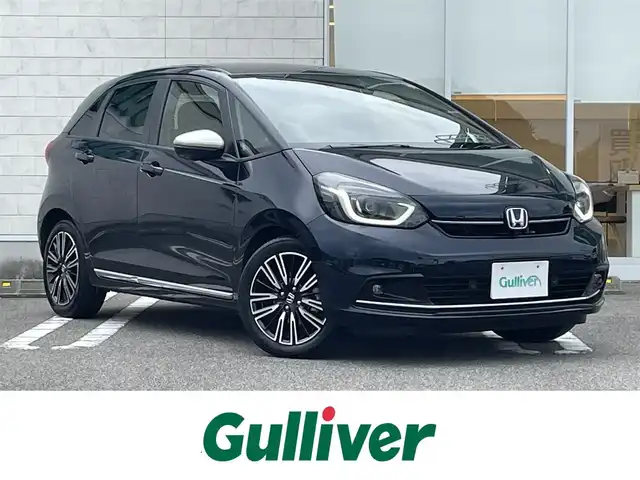 ホンダ フィット e:HEVリュクス 宮崎県 2023(令5)年 2.4万km ミッドナイトブルービームM ワンオーナー/純正ナビ/(AM.FM.Bluetooth.USB)/アラウンドビューモニター/ドライブレコーダー/ETC2.0/レーダークルーズコントロール/シートヒーター/ハンドルヒーター/オートライト/電格ミラー/パワーステアリング/スマートキー/スペアキー/衝突軽減ブレーキ/横滑り防止機能/レーンキープアシスト