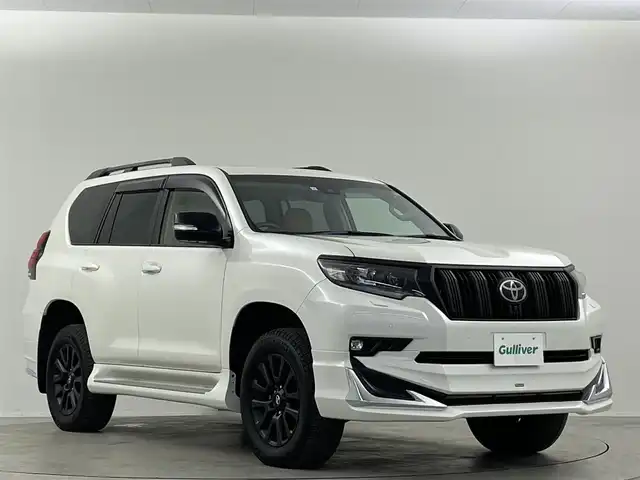 トヨタ ランドクルーザー プラド TX Lパッケージ マットブラED 埼玉県 2023(令5)年 2.6万km ホワイトパールクリスタルシャイン サンルーフ　モデリスタ純正９型ナビ　全方位　シートヒーター　ベンチレーションレーダークルーズコントロール　レーンキープアシスト　オートハイビームパワーシート　三列シートリア席電動格納　ＥＴＣ