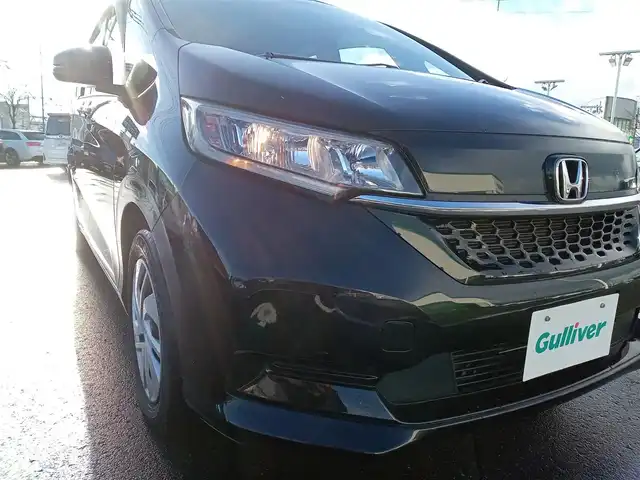 ホンダ フリード G ホンダセンシング 福井県 2020(令2)年 3.6万km クリスタルブラックパール 純正9インチナビ/AM/FM/フルセグ/BT/CD/DVD/バックカメラ/純正後席フリップダウンモニター/両側パワースライドドア/アダプティブクルーズコントロール/衝突被害軽減システム/レーンキープアシスト/横滑り防止装置/盗難防止装置/アイドリングストップ/ビルトインETC/ダブルエアバッグ/純正フロアマット/LEDヘッドライト/純正ホイルキャップ/スマートキー