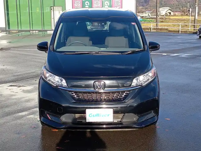 ホンダ フリード G ホンダセンシング 福井県 2020(令2)年 3.6万km クリスタルブラックパール 純正9インチナビ/AM/FM/フルセグ/BT/CD/DVD/バックカメラ/純正後席フリップダウンモニター/両側パワースライドドア/アダプティブクルーズコントロール/衝突被害軽減システム/レーンキープアシスト/横滑り防止装置/盗難防止装置/アイドリングストップ/ビルトインETC/ダブルエアバッグ/純正フロアマット/LEDヘッドライト/純正ホイルキャップ/スマートキー