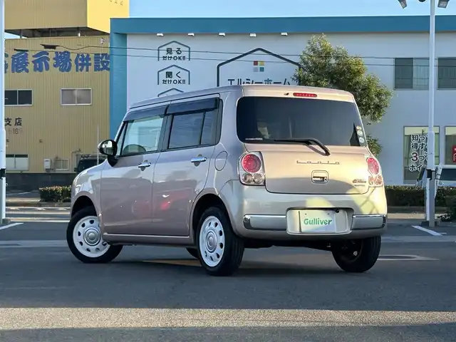 スズキ ラパン ショコラ X 愛媛県 2014(平26)年 4.4万km ピンク パナソニック製ナビ/BT/AM・FM/CD/DVD/バックカメラ/ETC/AAC/スマートキー/純正フロアマット/純正ホイールキャップ/アイドリングストップ/ベンチシート