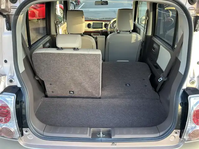 スズキ ラパン ショコラ X 愛媛県 2014(平26)年 4.4万km ピンク パナソニック製ナビ/BT/AM・FM/CD/DVD/バックカメラ/ETC/AAC/スマートキー/純正フロアマット/純正ホイールキャップ/アイドリングストップ/ベンチシート