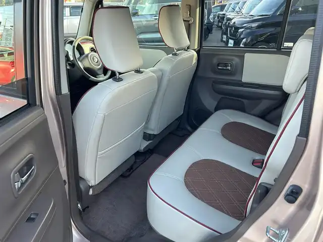 スズキ ラパン ショコラ X 愛媛県 2014(平26)年 4.4万km ピンク パナソニック製ナビ/BT/AM・FM/CD/DVD/バックカメラ/ETC/AAC/スマートキー/純正フロアマット/純正ホイールキャップ/アイドリングストップ/ベンチシート