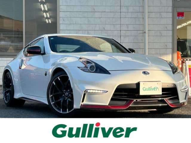 日産 フェアレディ Ｚ ニスモ 福岡県 2019(平31)年 2.3万km ブリリアントホワイトパール NISUMO専用装備/・フロントバンパー/・LEDハイパーディライト/・サイドシルプロテクター/・リアバンパー/・リアスポイラー/・マフラー/・レイズ製19インチAW/・RECARO製スポーツシート/・コンビメーター/・アルカンターラ巻3本スポークステアリング/・YAMAHA製パフォーマンスダンパー（フロント・リア）/・フロアマット/エンジンチューニング/純正赤色キャリパー/BOSEプレミアムサウンド/純正HDDナビ/　（AM/FM/CD/DVD/Bluetooth/フルセグTV）/バックカメラ/横滑り防止装置/パドルシフト/ASSURA製レーダー探知機【AR-333RA】/KENWOOD製前方ドライブレコーダー【DRV-MR740】/ビルトインETC/電格ウインカーミラー/電源ソケット×1/USB端子×1/スペアキー×1/保証書/エンジンチューニング保証書/取扱説明書/ナビ取扱説明書