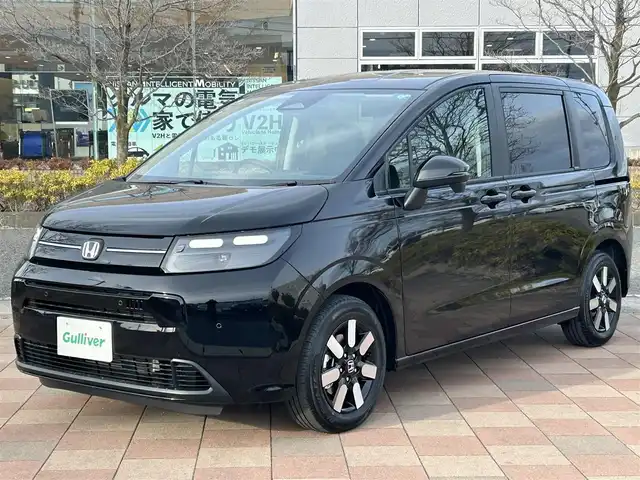 ホンダ フリード ハイブリット e:HEV AIR EX 福島県 2026(令8)年 0.1千km クリスタルブラックパール ホンダセンシング/・衝突軽減ブレーキ（CMBS）/・先行車発進お知らせ機能/・歩行者事故低減ステアリング/・路外逸脱抑制機能/・標識認識機能/・渋滞追従機能付アダプティブクルーズコントロール（ACC）/・車線維持支援システム（LKAS）/・トラフィックジャムアシスト（渋滞運転支援機能）/・ブラインドスポットインフォメーション/・誤発進抑制機能/・後方誤発進抑制機能/・近距離衝突軽減ブレーキ/・急アクセル抑制機能/・パーキングセンサーシステム/・オートハイビーム/純正メモリナビゲーション/LEDヘッドライト/・オートライト/スマートキー/・プッシュスタート/・スペアキー
