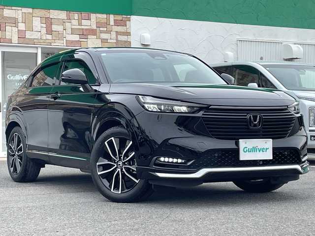 ホンダ ヴェゼル ハイブリッド e:HEV Z 徳島県 2023(令5)年 3.4万km クリスタルブラックパール 純正9インチナビ/(AM.FM.BT.フルセグ.カープレイ)/ハンズフリーパワーテールゲート（予約クローズ機能付）/ETC2.0/ホンダセンシング/・衝突軽減ブレーキ（CMBS）/・踏み間違い衝突軽減システム/・誤発進抑制機能/・後方誤発進抑制機能/・近距離衝突軽減ブレーキ/・渋滞追従機能付アダプティブクルーズコントロール（ACC）/・トラフィックジャムアシスト（渋滞運転支援機能）/・車線維持支援システム（LKAS）/・ブラインドスポットインフォメーション/・LEDアクティブコーナリングライト/・パーキングセンサーシステム/・オートハイビーム/ドラレコ/パドルシフト/シートヒーター