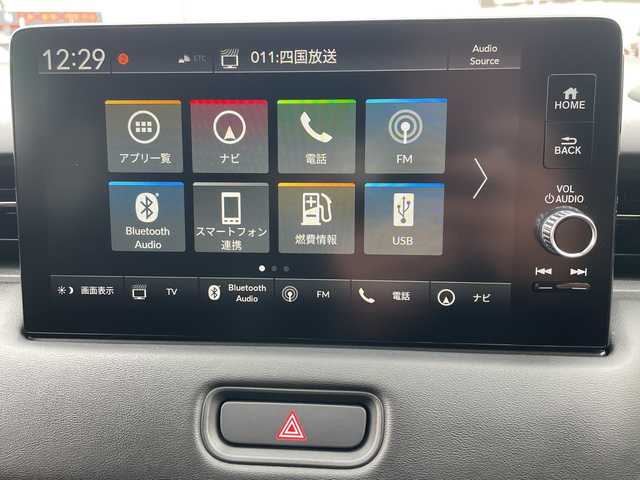 ホンダ ヴェゼル ハイブリッド e:HEV Z 徳島県 2023(令5)年 3.4万km クリスタルブラックパール 純正9インチナビ/(AM.FM.BT.フルセグ.カープレイ)/ハンズフリーパワーテールゲート（予約クローズ機能付）/ETC2.0/ホンダセンシング/・衝突軽減ブレーキ（CMBS）/・踏み間違い衝突軽減システム/・誤発進抑制機能/・後方誤発進抑制機能/・近距離衝突軽減ブレーキ/・渋滞追従機能付アダプティブクルーズコントロール（ACC）/・トラフィックジャムアシスト（渋滞運転支援機能）/・車線維持支援システム（LKAS）/・ブラインドスポットインフォメーション/・LEDアクティブコーナリングライト/・パーキングセンサーシステム/・オートハイビーム/ドラレコ/パドルシフト/シートヒーター
