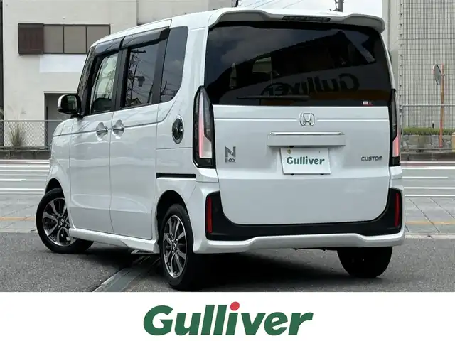 ホンダ Ｎ ＢＯＸ カスタム 三重県 2024(令6)年 1.8万km プラチナホワイトパール ホンダセンシング/純正9インチナビ/　・フルセグ/　・Bluetooth/　・ＵＳＢ（アップルカープレイ、アンドロイドオート）/　・ＤＶＤ/　・ＣＤ/両側パワースライドドア/LEDヘッドライト/LEDフォグライト/オートハイビーム/クルーズコントロール/D/N席シートヒーター/スマートキー/プッシュスタート/ソナーセンサー/シートバックテーブル/ステアリングスイッチ/オートリトラクタブルミラー/ターンミラー