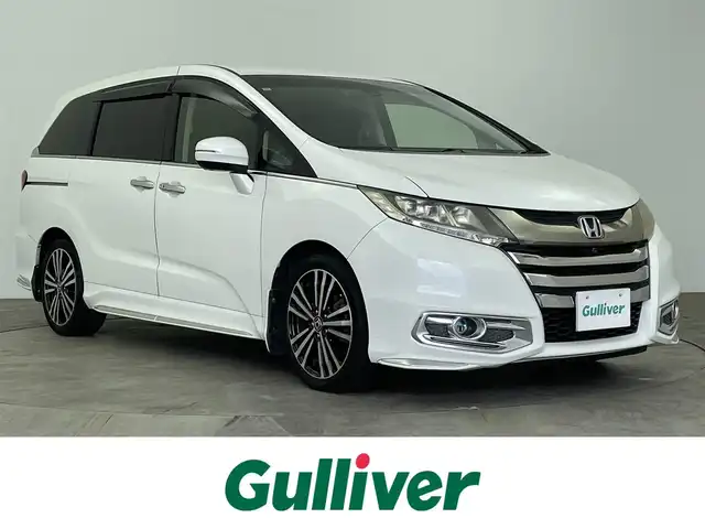 ホンダ オデッセイ アブソルート EX ADV 大分県 2015(平27)年 7.4万km ホワイトオーキッドパール 純正ナビ/（フルセグ/CD/DVD/Bluetooth）/全方位カメラ/フリップダウンモニター/ビルトインETC/前方ドライブレコーダー/衝突軽減ブレーキ/ブラインドスポットモニター/レーダークルーズコントロール/レザーシート/前席シートヒーター/運転席パワーシート/両側パワースライドドア/ステアリングスイッチ/保証書・取扱説明書/カーテンエアバッグ