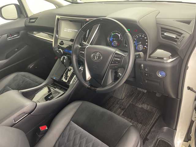 トヨタ ヴェルファイア ハイブリット 道央・札幌 2015(平27)年 5.1万km ホワイトパールクリスタルシャイン ・4WD/・JBLサウンドナビ/（CD DVD SD BT USB フルセグ）/・モデリスタエアロ（F S R）/・モデリスタマフラーカッター/・トヨタセーフティセンス/・純正フリップダウン/・両側パワースライドドア/・クルーズコントロール/・クリアランスソナー/・社外ワイヤレス充電/・パーキングアシスト/・LEDヘッドライト/・オートマチックハイビーム/・ハーフレザーシート