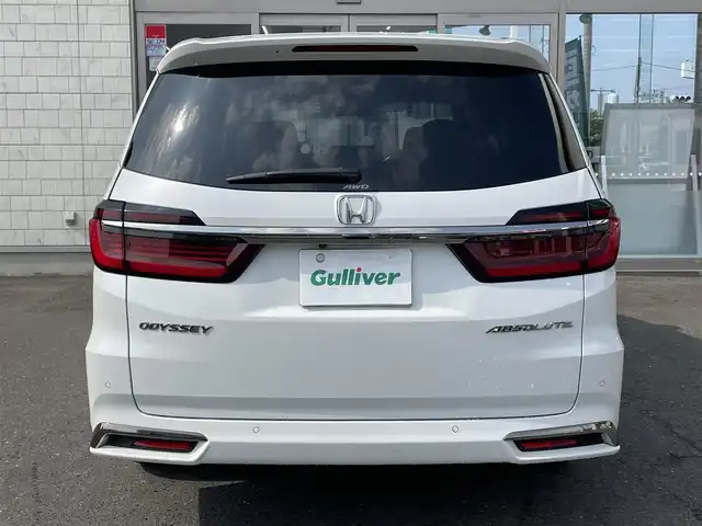 ホンダ オデッセイ アブソルート EX 青森県 2022(令4)年 3.3万km プラチナホワイトパール ４WD/純正ディーラーOPナビ(CD/DVD/BT/フルセグ)/15.6インチリア席モニター/両側パワースライドドア/ジェスチャーコントロールスライドドア/アダプティブクルーズコントロール/レーンキープアシスト/パーキングアシスト/クリアランスソナー/ブラインドスポットモニター/マルチビューモニター（フロント/バック/サイド/全周囲）/ビルトインETC2.0/アイドリングストップ/ECONモード/前席シートヒーター/ハーフレザーシート/革巻きステアリング/ステアリングリモコン/パドルシフト/プッシュスタート/スマートキー/LEDヘッドライト/オートライト/フォグランプ/純正フロアマット/ドアバイザー/18インチアルミホイール/社外AW付冬タイヤ積込/純正エンジンスターター/スペアキー