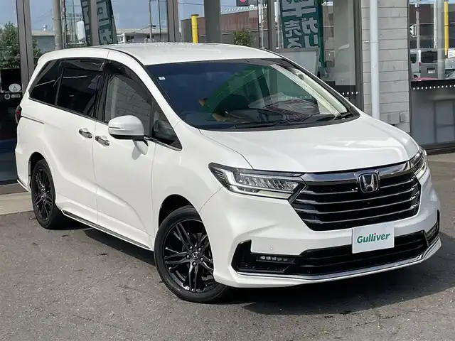 ホンダ オデッセイ アブソルート EX 青森県 2022(令4)年 3.3万km プラチナホワイトパール ４WD/純正ディーラーOPナビ(CD/DVD/BT/フルセグ)/15.6インチリア席モニター/両側パワースライドドア/ジェスチャーコントロールスライドドア/アダプティブクルーズコントロール/レーンキープアシスト/パーキングアシスト/クリアランスソナー/ブラインドスポットモニター/マルチビューモニター（フロント/バック/サイド/全周囲）/ビルトインETC2.0/アイドリングストップ/ECONモード/前席シートヒーター/ハーフレザーシート/革巻きステアリング/ステアリングリモコン/パドルシフト/プッシュスタート/スマートキー/LEDヘッドライト/オートライト/フォグランプ/純正フロアマット/ドアバイザー/18インチアルミホイール/社外AW付冬タイヤ積込/純正エンジンスターター/スペアキー