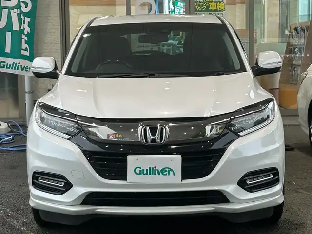 ホンダ ヴェゼル ハイブリッド Z ホンダセンシング 熊本県 2018(平30)年 9.8万km プラチナホワイトパール 4WD/ホンダセンシング/プッシュスタート/純正ナビ/（CD・DVD・フルセグTV・BTオーディオ・SD）/バックカメラ/ビルトインETC/ドライブレコーダー/純正17インチAW/レーダークルーズ/パドルシフト/レザー調シートカバー/前席シートヒーター/LEDヘッドライト/オートライト/LEDフォグライト/横滑り防止装置/ウィンカーミラー/純正フロアマット/純正ドアバイザー/新車保証書/取扱説明書/スマートスペアキー×1本